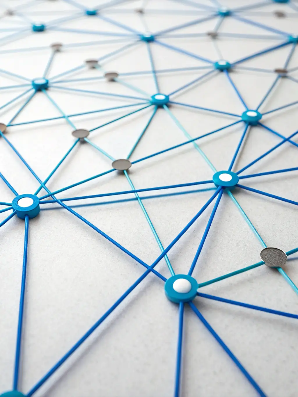 Abstract representation of an Enterprise Service Bus (ESB) with geometric shapes and lines, using a gradient from #004080 to #333333 to convey the concept of data transformation and routing.